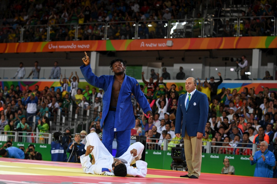 Popole Misenga celebrates the first-ever win of a refugee athlete in the Olympic Games. Popole Misenga celebrates the first-ever win of a refugee athlete in the Olympic Games.