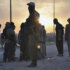 Fighters of the Islamic State of Iraq and the Levant (ISIL) stand guard at a checkpoint in the northern Iraq city of Mosul