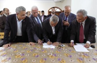 Head of the Hamas government Ismail Haniyeh and senior Fatah official Azzam Al-Ahmed sign a reconciliation agreement in Gaza City Head of the Hamas government Ismail Haniyeh and senior Fatah official Azzam Al-Ahmed sign a reconciliation agreement in Gaza City