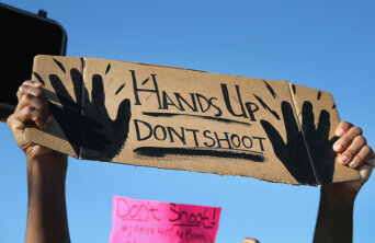 protest-sign-over-ferguson-shooting-data