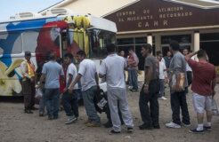 Returned migrants board a bus to Tegucigalpa in front the Center for Returned Migrants, San Pedro Sula airport, Honduras, September 2014. © 2014 Stephen Ferry for Human Rights Watch Returned migrants board a bus to Tegucigalpa in front the Center for Returned Migrants, San Pedro Sula airport, Honduras, September 2014. © 2014 Stephen Ferry for Human Rights Watch