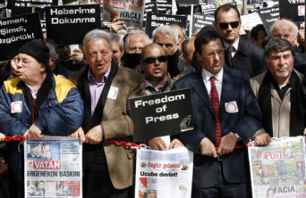 Journalists and activists participate in a rally calling for press freedom in central Ankara