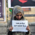 a-girl-caryying-card-that-says-death-of-Farkhunda-was-the-death-of-humanity
