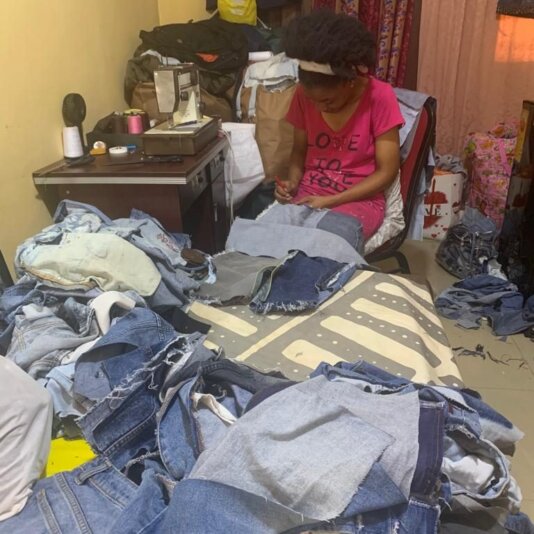 Catharina Nathang sorting and designing from collected fashion waste– Photo Credits, Catharina Natang