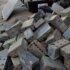E-Waste-...-a-mountain-of--solar-batteries-backed-with-concrete,-sand,-glass-and-other-matter
