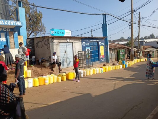 People queing up for water at a SHOFCO kiosk in Kibra - photo by Joseph Maina (1)