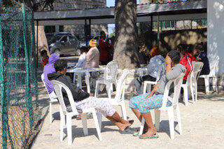 A group of migrants sitting outside a shelter in Sin el Fil, Beirut, Lebanon.