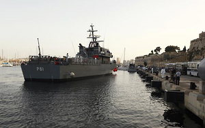 An Armed Forces of Malta ship carrying rescued migrants arrives at the AFM Maritime Squadron base at Haywharf in Valletta