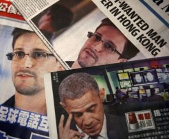 Photos of Snowden, a contractor at the NSA, and U.S. President Obama are printed on the front pages of local English and Chinese newspapers in Hong Kong in this illustration photo