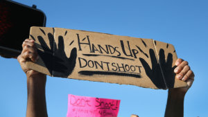 protest-sign-over-ferguson-shooting-data