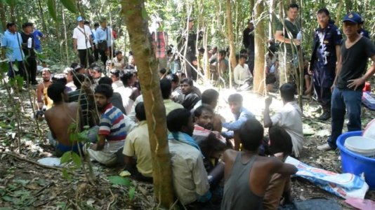 After the trip on a boat the victims are held in jungle camps. After the trip on a boat the victims are held in jungle camps.