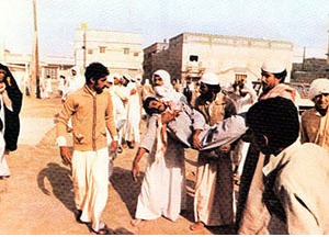 Demonstrators carrying the body of a fellow protester killed in clashes with security forces during the November 1979 unrest in Eastern Province, Saudi Arabia.