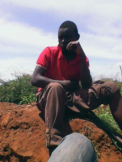 Gold panner resting by the shaft side in Mberengwa.