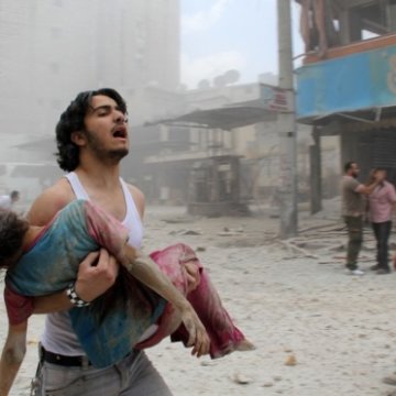 man trying to rescue child_syria man trying to rescue child_syria