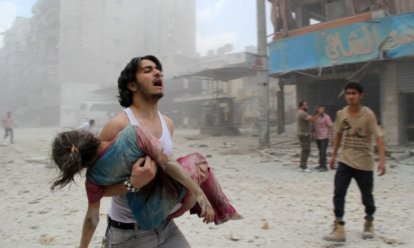 man trying to rescue child_syria man trying to rescue child_syria