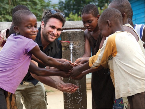 Josh Braunstein enjoys using first clean water (tap) with children in the village of Ekanjoh Bajoh. Josh Braunstein enjoys using first clean water (tap) with children in the village of Ekanjoh Bajoh.