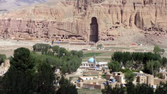 A view of Bamiyan with the empty cave that once hold the Buddah statue