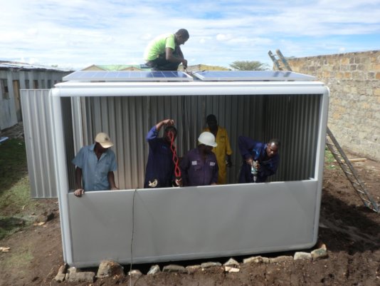 A team of workers in Kenya is working on putting up another SOLARKIOSK. A team of workers in Kenya is working on putting up another SOLARKIOSK.