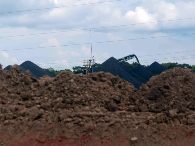The hills of pet coke in the storage facility in Jaltipan The hills of pet coke in the storage facility in Jaltipan