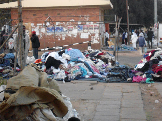 Vendors displaying clothes along Lobengula Street in Bulawayo/Zimbabwe Vendors displaying clothes along Lobengula Street in Bulawayo/Zimbabwe