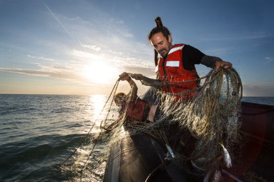 Ruben Albarrán, a Greenpeace activist from the Meixcan group Café Tacuba looks for illegal fishing nets in the Sea of Cortés.