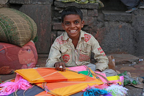 A kite seller at the Dili Diwarja Kite Market in India.