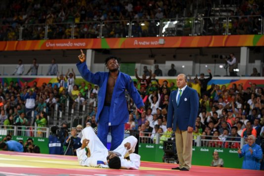 Popole Misenga celebrates the first-ever win of a refugee athlete in the Olympic Games.