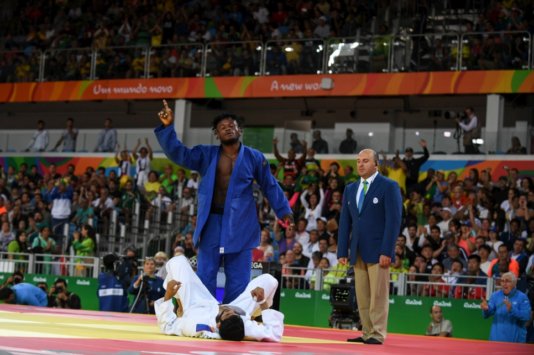 Popole Misenga celebrates the first-ever win of a refugee athlete in the Olympic Games. Popole Misenga celebrates the first-ever win of a refugee athlete in the Olympic Games.