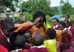 Kakenya enjoys a moment with some of the girls