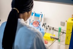 Female scientist with petri dish