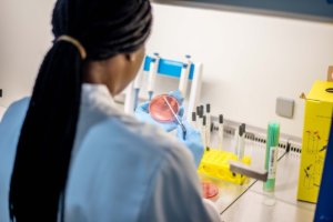 Female scientist with petri dish