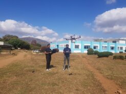 Students start a drone outside the African Drone and Data Academy. © Hope Chilunga Outside African Drone and Data Academy