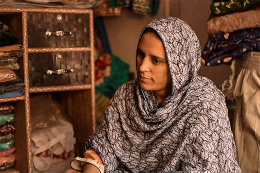 Bushra Farooq works in a local boutique in north Kashmir\'s Kupwara district. She has been working there since her husband, for whom she left her homeland of Pakistan, divorced her.
