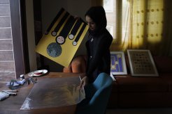 1. The women of Yemen carrying forward the heritage of Yemen the buildings of Old Sanaa (Photo by Kamran Yousuf)