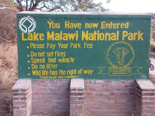 A signpost located at the entrance to the national park.