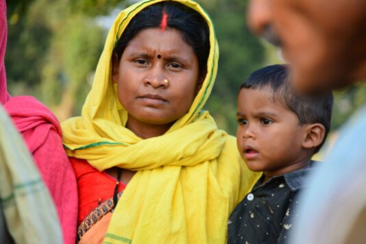 Sunita Purte with her son at the protest site.