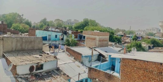 Slum Homes in Saraspur area of Ahmedabad being painted with solar reflective white paint.