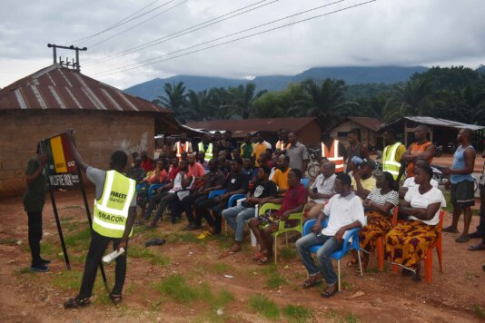 Training farmers on the interpretation of color coded signpost.