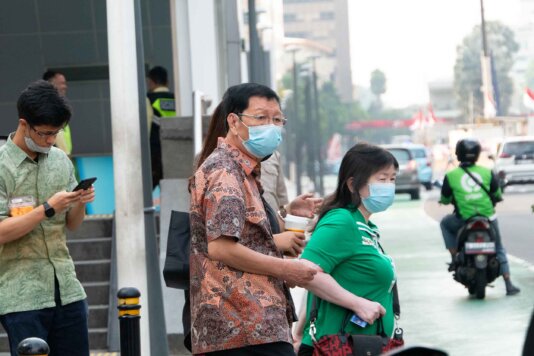 Jakarta residents wearing masks in the street. As the capital of Indonesia, Jakarta currently faces the most severe air pollution among its fellow ASEAN member countries.