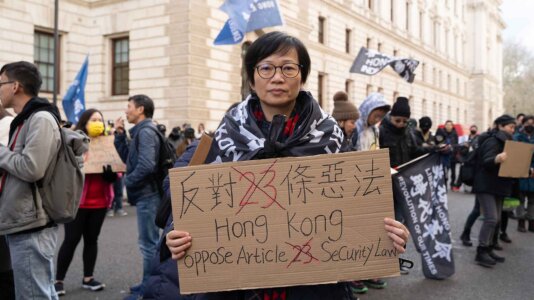 Protester Sofia Law held a banner in a protest opposing Hong Kong’s Article 23 in London on 23 March. Protester Sofia Law held a banner in a protest opposing Hong Kong’s Article 23 in London on 23 March.