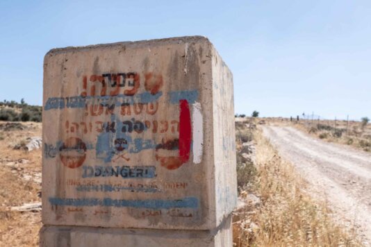 Israeli signage warning of entering Firing Zone 918, close to At-Tuwani, West Bank. Israeli signage warning of entering Firing Zone 918, close to At-Tuwani, West Bank.