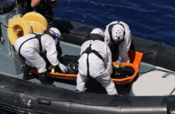 members of Life Support recovering a dead body