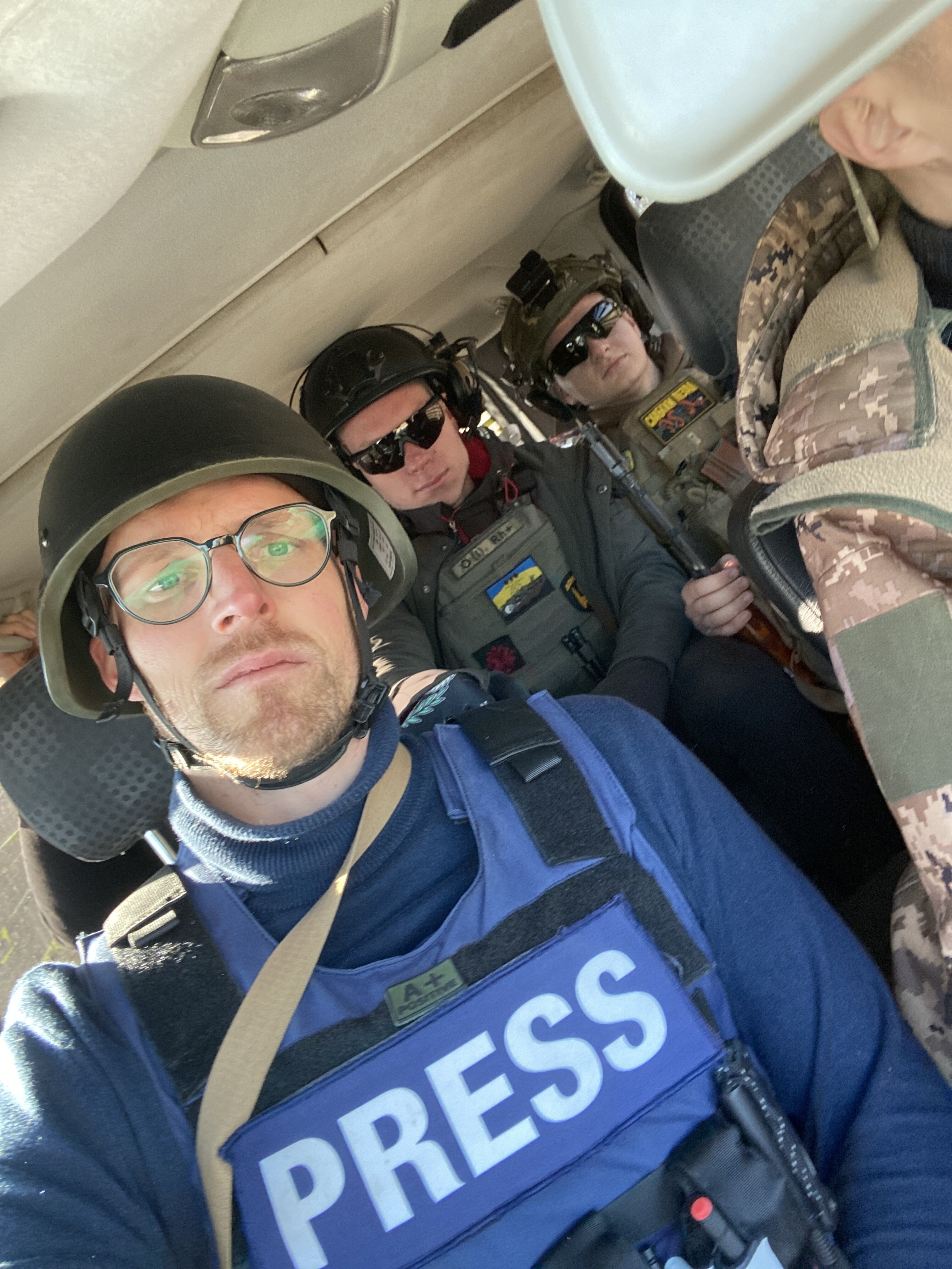 Author Fabian Janssen (Front left) with fixer Yehor Konovalov (back left) reporting from Ukraine